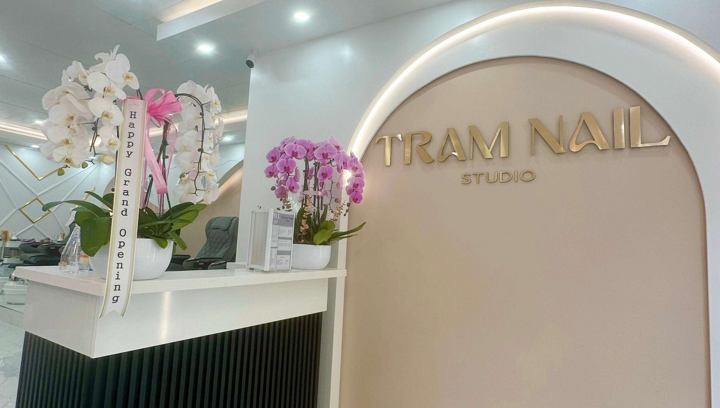 Tram Nail Studio reception with gold signage